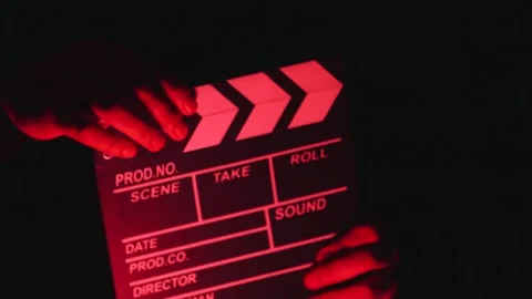Video of anonymous person using a clapperboard in a local film production. Stock Footage 261928144