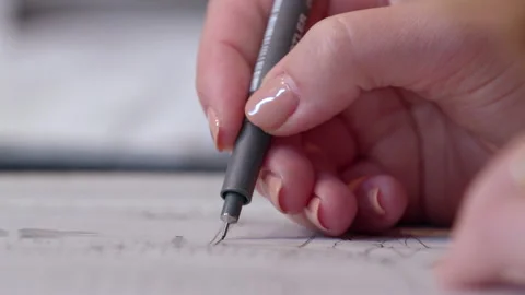 A video of an architect drawing with fine tip pen on paper 스톡 동영상 163026921