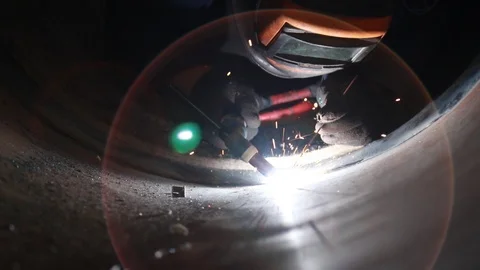 Video of the argon arc welding process inside a large diameter pipe. Root wel Stock Footage 101008364