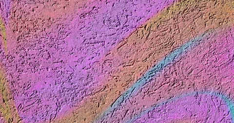 Video background of colorful bright gradient pink, blue and gold textured cement Stock Footage 269974253