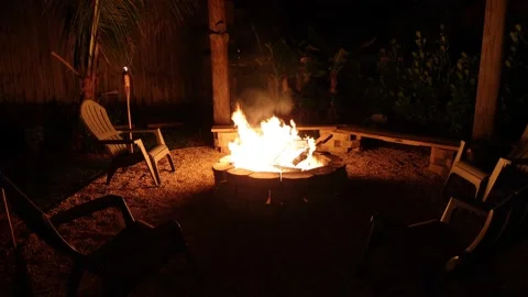 This is a video of a backyard tropical firepit. Stock Footage 153453076