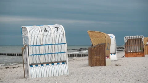 Video of beach chairon white sand at windy cloudy weather at Baltic sea in Ge Stock Footage 134331857