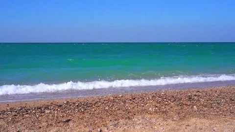 Video from the beach as the waves hit the sandy shore Stock Footage 142399730