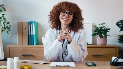 Video of beautiful nutritionist looking at camera while working on computer.. Stock Footage 340831176