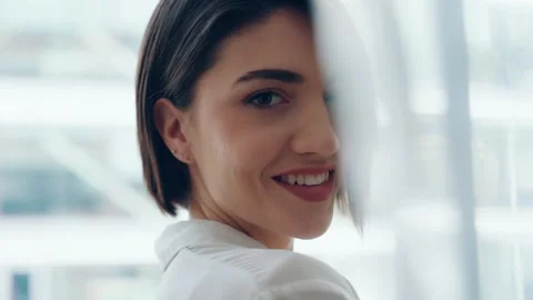 Video of beautiful woman posing while standing next to the window at home Stock Footage 313357571