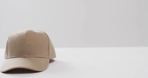 Video of beige baseball cap and copy space on white background 스톡 동영상 247354461
