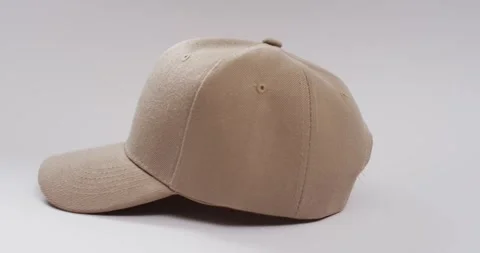 Video of beige baseball cap and copy space on white background 스톡 동영상 247354468