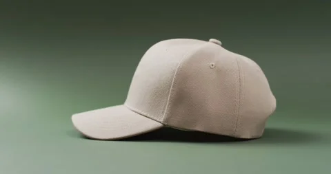 Video of beige baseball cap and copy space on green background 스톡 동영상 331246414