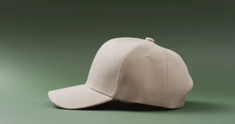 Video of beige baseball cap and copy space on green background 스톡 동영상 331247954
