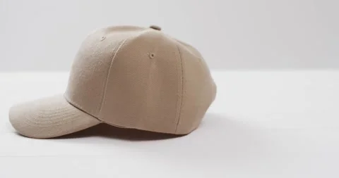 Video of beige baseball cap and copy space on white background 스톡 동영상 331358730