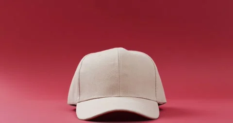 Video of beige baseball cap and copy space on red background 스톡 동영상 331358741