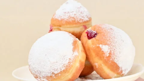 Video of Berliners (German donuts) with raspberry jam Stock Footage 344921958