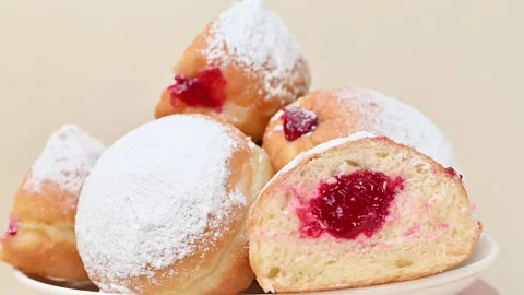 Video of Berliners (German donuts) with raspberry jam Stock Footage 344922190