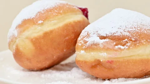 Video of Berliners (German donuts) with raspberry jam Stock Footage 344922830