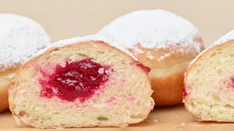 Video of Berliners (German donuts) with raspberry jam Stock Footage 344923252