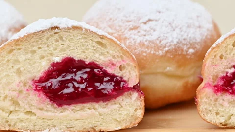Video of Berliners (German donuts) with raspberry jam Stock Footage 344923706