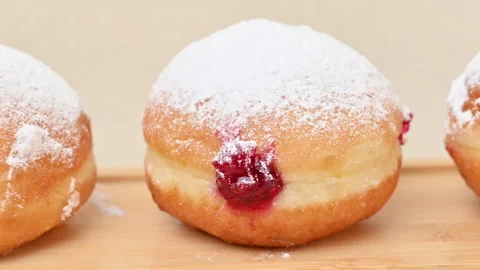 Video of Berliners (German donuts) with raspberry jam Stock Footage 344923737