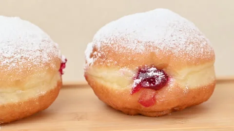 Video of Berliners (German donuts) with raspberry jam Stock Footage 344924072