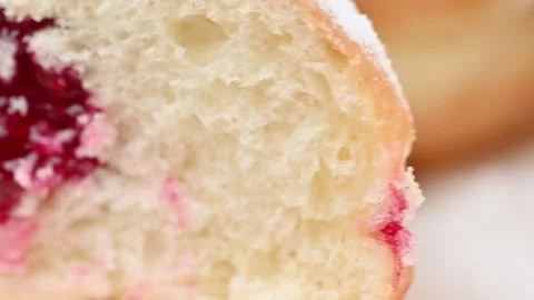 Video of Berliners (German donuts) with raspberry jam Stock Footage 344924177