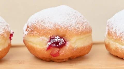 Video of Berliners (German donuts) with raspberry jam Stock Footage 344924415