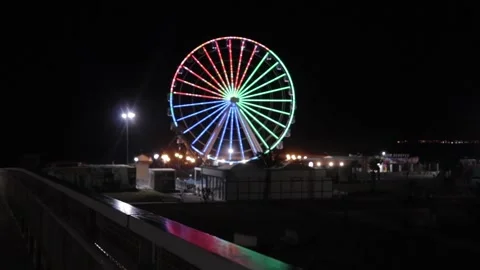 Video of the big wheel turning with colored lights Stock Footage