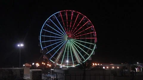 Video of the big wheel turning with colored lights Stock Footage 152304320