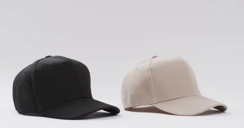 Video of black and beige baseball caps and copy space on white background 스톡 동영상 331208620