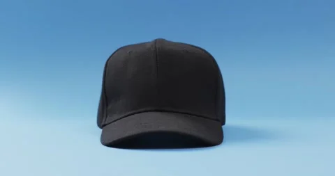 Video of black baseball cap and copy space on blue background 스톡 동영상 331246424