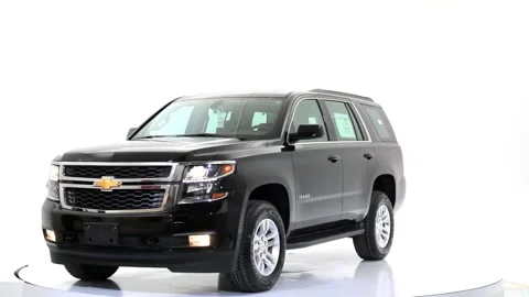 A video of a black large size SUV Stock Footage 243489237