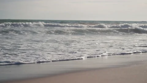 Video of blue sea waves in a cold winter on the beach. Video stock 235671548