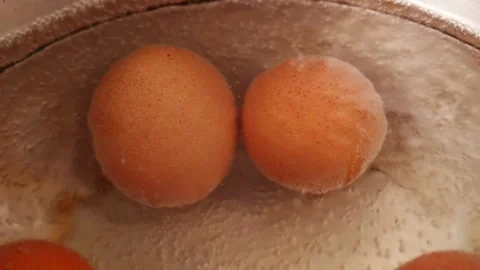 Video of boiling eggs in a pot (close-up). Food preparation concept. Stock Footage 231541156
