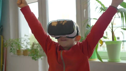 Video of boy exploring virtual reality and winning game in 4k slow motion Stock Footage 86027122