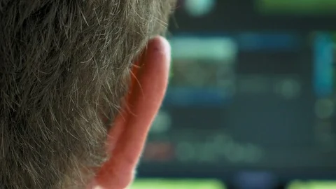 Video broadcast editor against screen Video stock 70006933