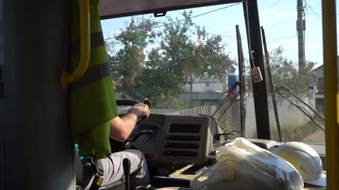Video from the bus cabin, driver, white helmets of construction workers Stock Footage 300867744
