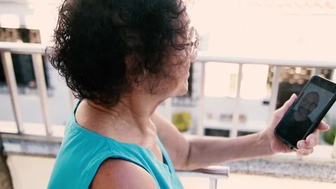 Video call between son and mother during quarentine Stock Footage 137522347