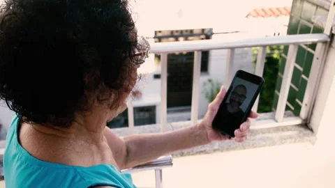 Video call between son and mother during quarentine Stock Footage 137522353