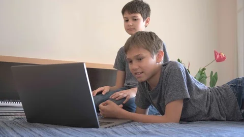 Video call. Children with laptop computer at home Stock-Footage 128792913