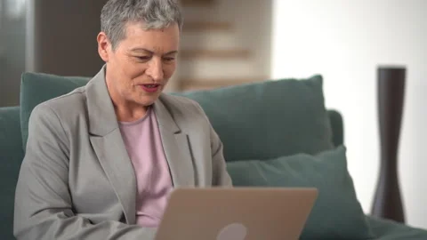 Video call concept, lovely elderly woman with short grey haircut, smiling Stock Footage 169478113
