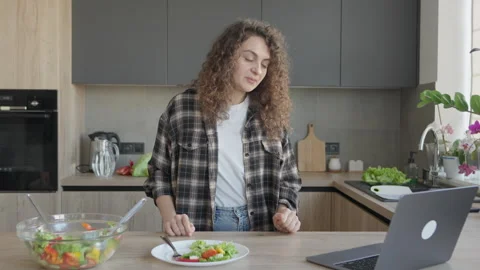 Video Call From Kitchen While Standing Near Salad Plate, Engaged In Chat Stock Footage 311270144