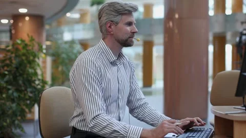 Video call, man with headset and tablet computer looking at camera Stock Footage 340067927