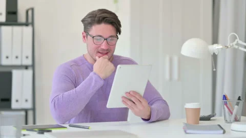 Video Call on Tablet by Creative Middle Aged Man 스톡 동영상 143568416