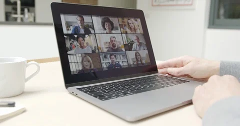 Video call with team online from kitchen on laptop Stock Footage 127859622