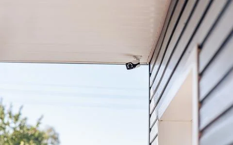 Video camera for home security, camera installation Stock Photos