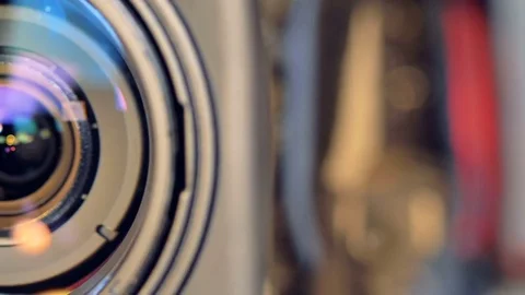 A video camera lens opens up during zoom. Stock Footage