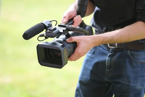 Video camera man with camera Stock Photos
