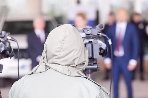 Video camera operator working at press conference Stock Photos