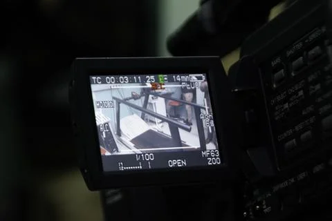 Video camera or camcorder operator working for record - screen on recording. Foto stock