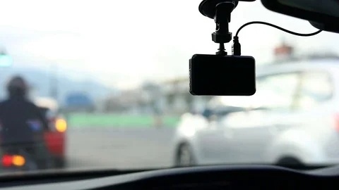 Video camera recorder in car driving on traffic road, slow motion shot Stock Footage 81267959