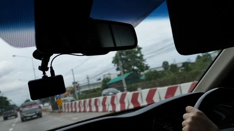 Video camera recorder on front windshield with car driving on road trips Video stock 94177340