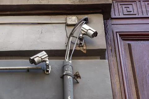 Video camera security system on the wall of the building Stock Photos